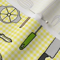 essential utensils on yellow gingham