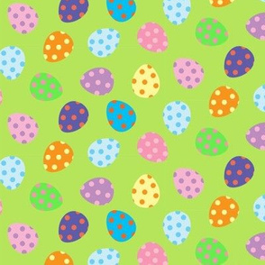 Easter eggs bright and colorful with green background