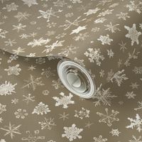 large photographic snowflakes on tan