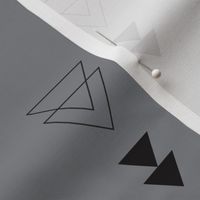 Geometric triangle in trendy black gray white and pastel blue