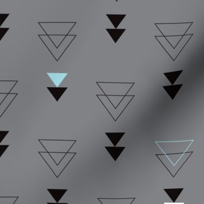 Geometric triangle in trendy black gray white and pastel blue