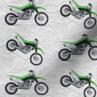 Green Dirt Bike with grey dirt background