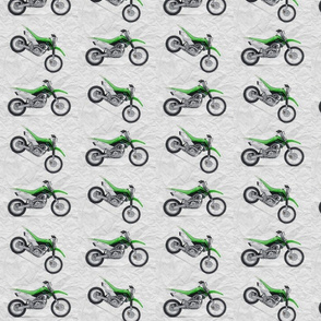 Green Dirt Bike with grey dirt background