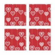 White lace hearts on a red background, a romantic and festive pattern.