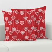 White lace hearts on a red background, a romantic and festive pattern.