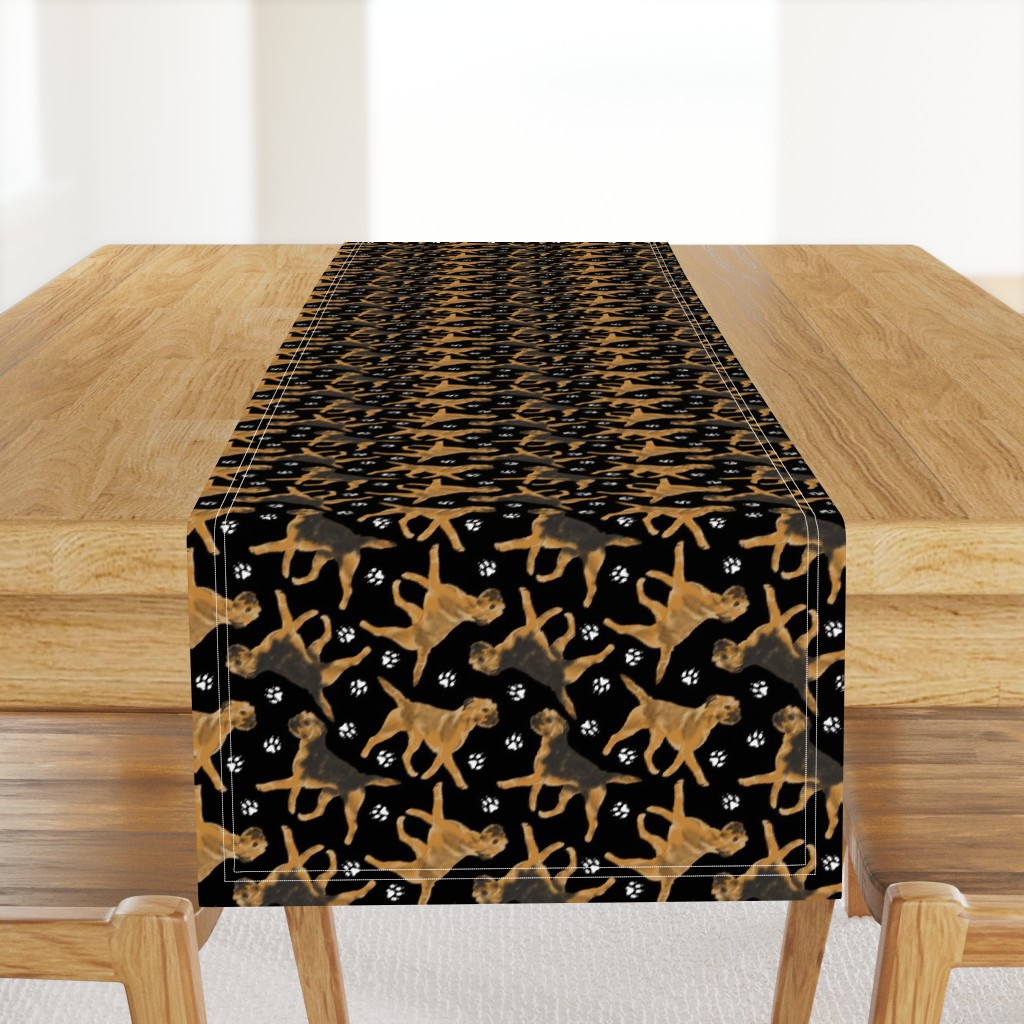 Trotting Border Terriers and paw prints - black