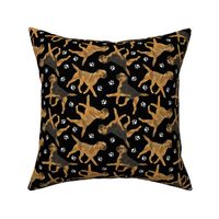 Trotting Border Terriers and paw prints - black