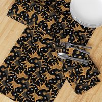 Trotting Border Terriers and paw prints - black