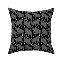 Trotting Schipperke and paw prints - black