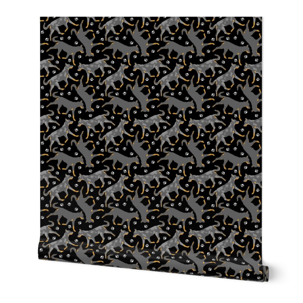 Trotting cropped Beaucerons and paw prints - black