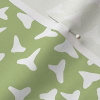 shark tooth silhouettes on pale green