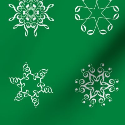 musical snowflakes large on deep spearmint green