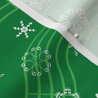 wind-blown musical snowflakes on deep spearmint green