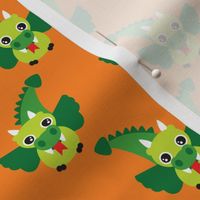 Cute little dragon fantasy dinosaur kids illustration in orange and green