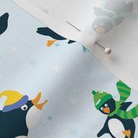 penguins sliding in the snow
