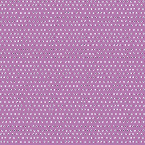 White, blue and pink dots on purple