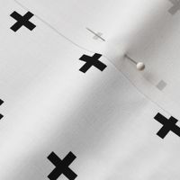 black cross on white brick pattern