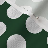 1" golf ball on forest green