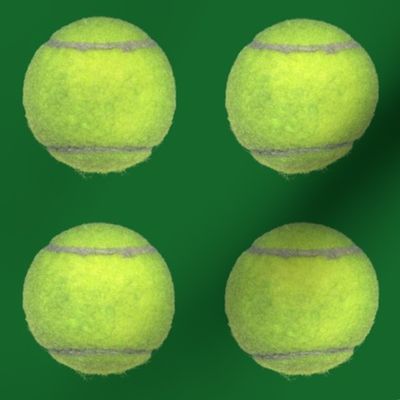 4" tennis balls on green