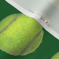 4" tennis balls on green