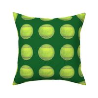 4" tennis balls on green