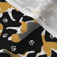 Trotting Beagles and paw prints - black