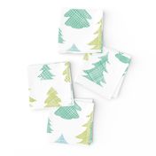 Green blue Christmas trees silhouettes textile seamless pattern