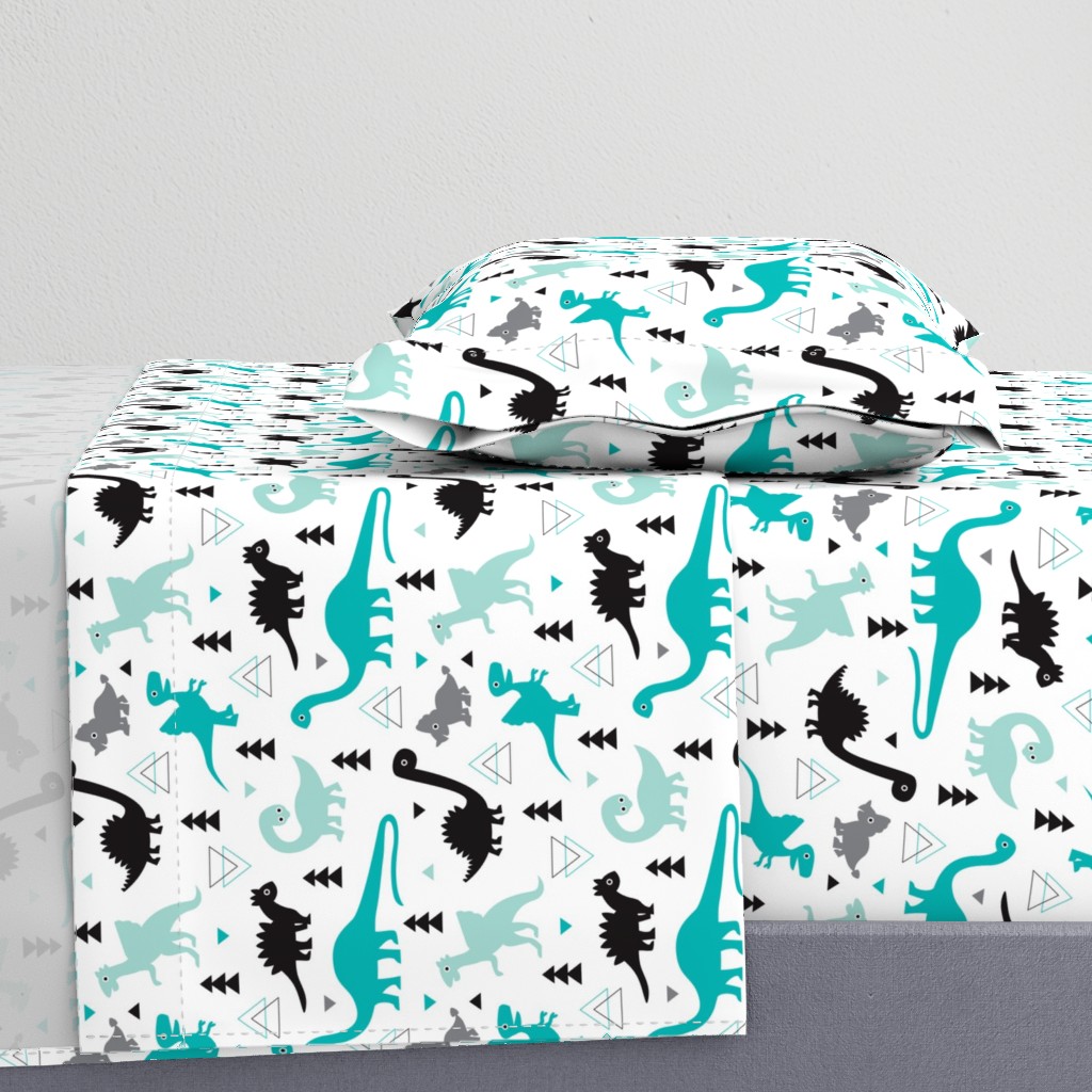 Adorable dino boys fabric with black and blue dinosaur geometric triangles and funky animal illustration theme for kids