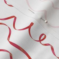 red curling ribbons on white