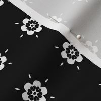 White Geometric Flowers on Black