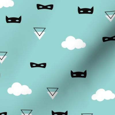 Geometric triangles and kids masks with clouds on blue