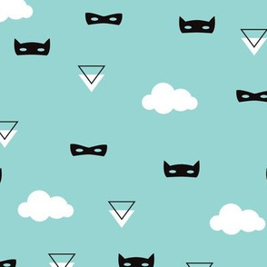 Geometric triangles and kids masks with clouds on blue