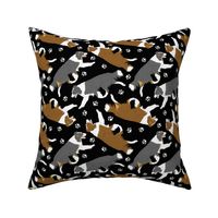 Trotting Border Collies and paw prints - black