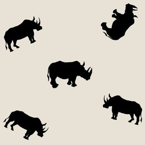 Rhino Silhouettes on Sand Background