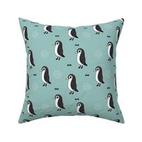 Adorable baby penguin geometric birds illustration and cross and arrow details pattern winter blue