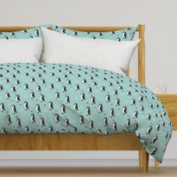 Adorable baby penguin geometric birds illustration and cross and arrow details pattern winter blue