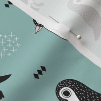 Adorable baby penguin geometric birds illustration and cross and arrow details pattern winter blue