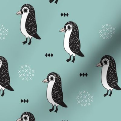 Adorable baby penguin geometric birds illustration and cross and arrow details pattern winter blue