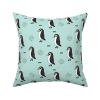 Adorable baby penguin geometric birds illustration and cross and arrow details pattern winter mint blue