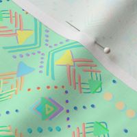 Soft bright geometric shapes and dots on mint