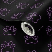 Pawprint Outline Polka dots - 1 inch (2.54cm) - Mid Purple (#a25bb1) on Black (#000000)