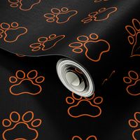 Pawprint Outline Polka dots - 1 inch (2.54cm) - Mid Orange (#FF5F00) on Black (#000000)