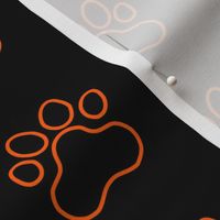 Pawprint Outline Polka dots - 1 inch (2.54cm) - Mid Orange (#FF5F00) on Black (#000000)