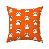 Pawprint Polka dots - 1 inch (2.54cm) - White (#FFFFFF) on Mid Orange (#FF5F00)