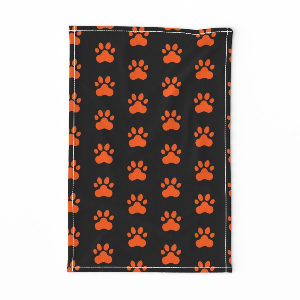 Pawprint Polka dots - 1 inch (2.54cm) - Mid Orange (#FF5F00) on Black (#000000)