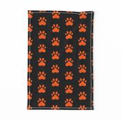 Pawprint Polka dots - 1 inch (2.54cm) - Mid Orange (#FF5F00) on Black (#000000)