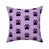 Pawprint Polka dots - 1 inch (2.54cm) - Black (#000000) on Pale Purple (#CB9FD9)