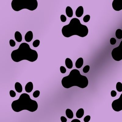 Pawprint Polka dots - 1 inch (2.54cm) - Black (#000000) on Pale Purple (#CB9FD9)