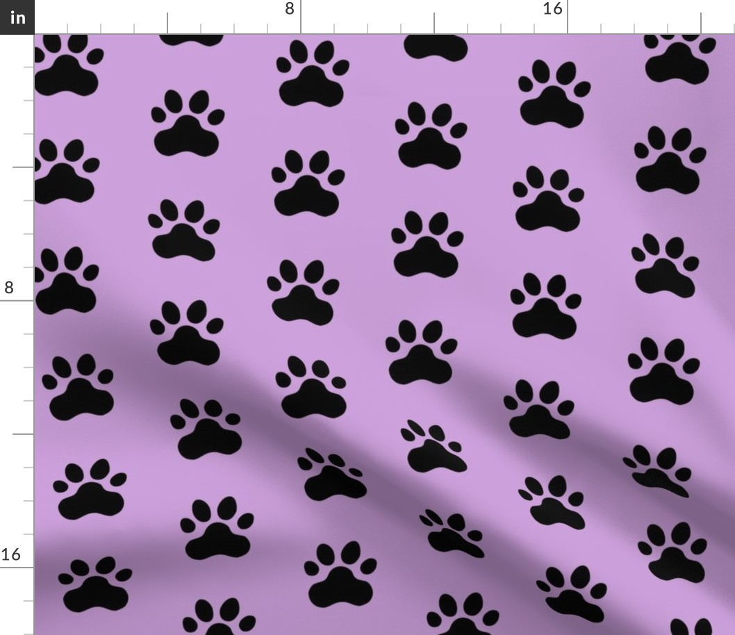 Pawprint Polka dots - 1 inch (2.54cm) - Black (#000000) on Pale Purple (#CB9FD9)