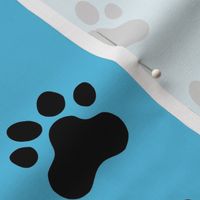 Pawprint Polka dots - 1 inch (2.54cm) - Black (#000000) on Pale Blue (#57BEE4)